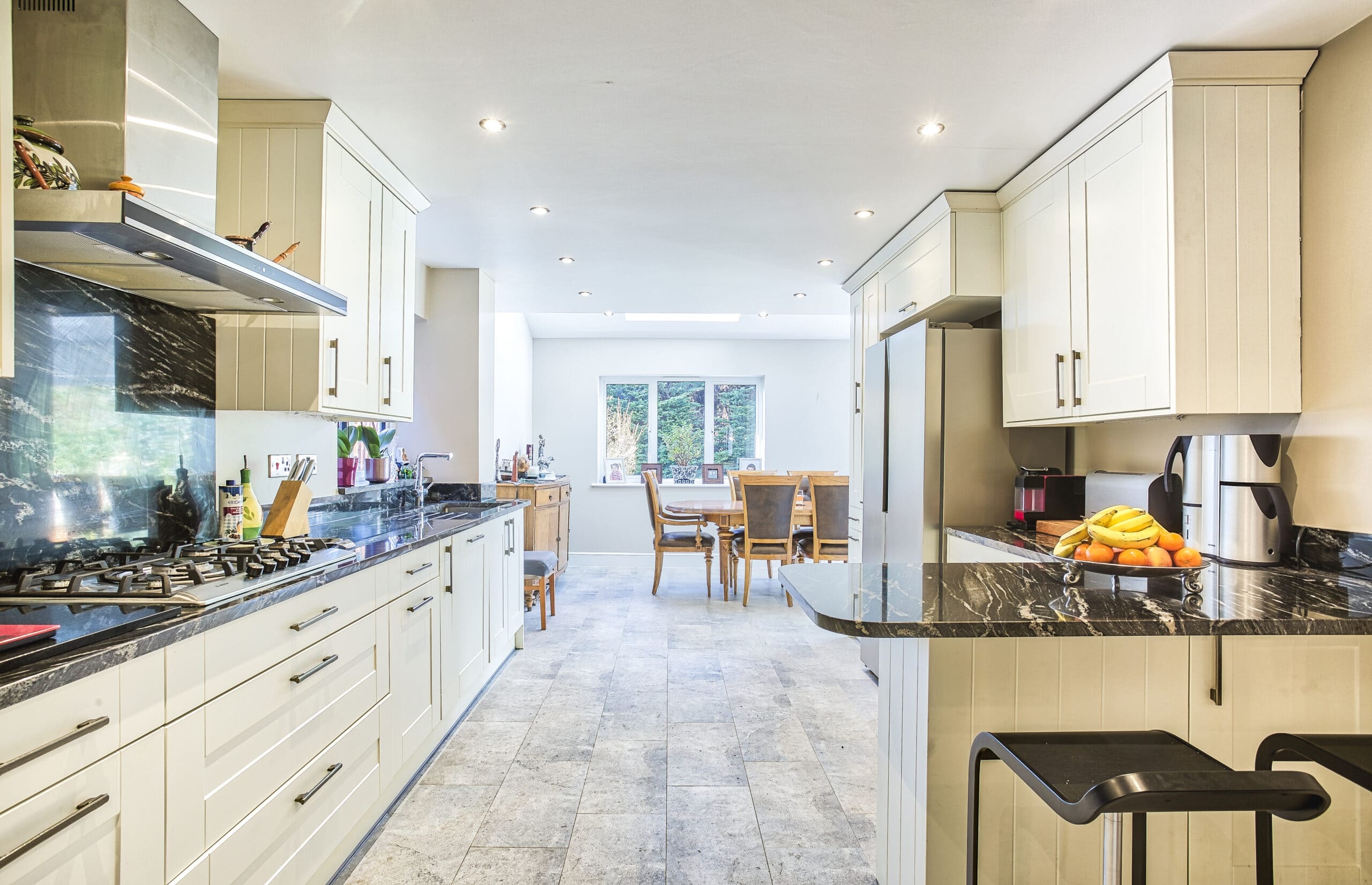 Smart new kitchen with cream units and granite worktops